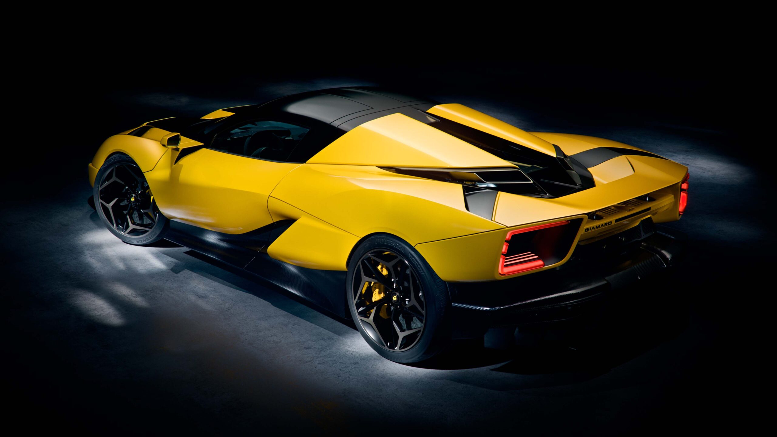 Giamaro Krafla rear three-quarter view in yellow — studio shot showing active aerodynamics