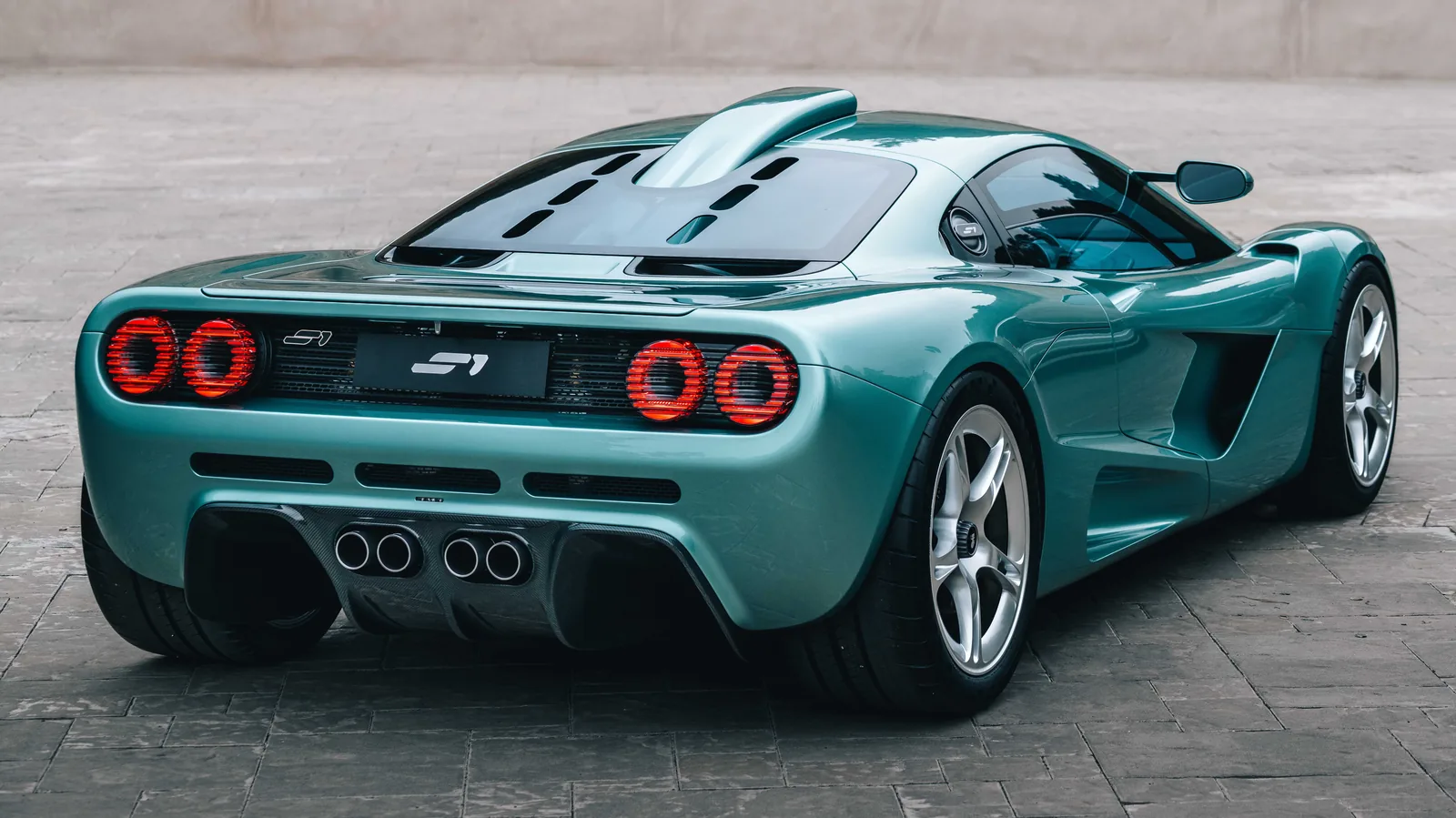 Gordon Murray S1 side profile showing lowered roofline, dihedral doors and Monaco-1992-inspired lightweight wheels at Monterey Car Week 2026