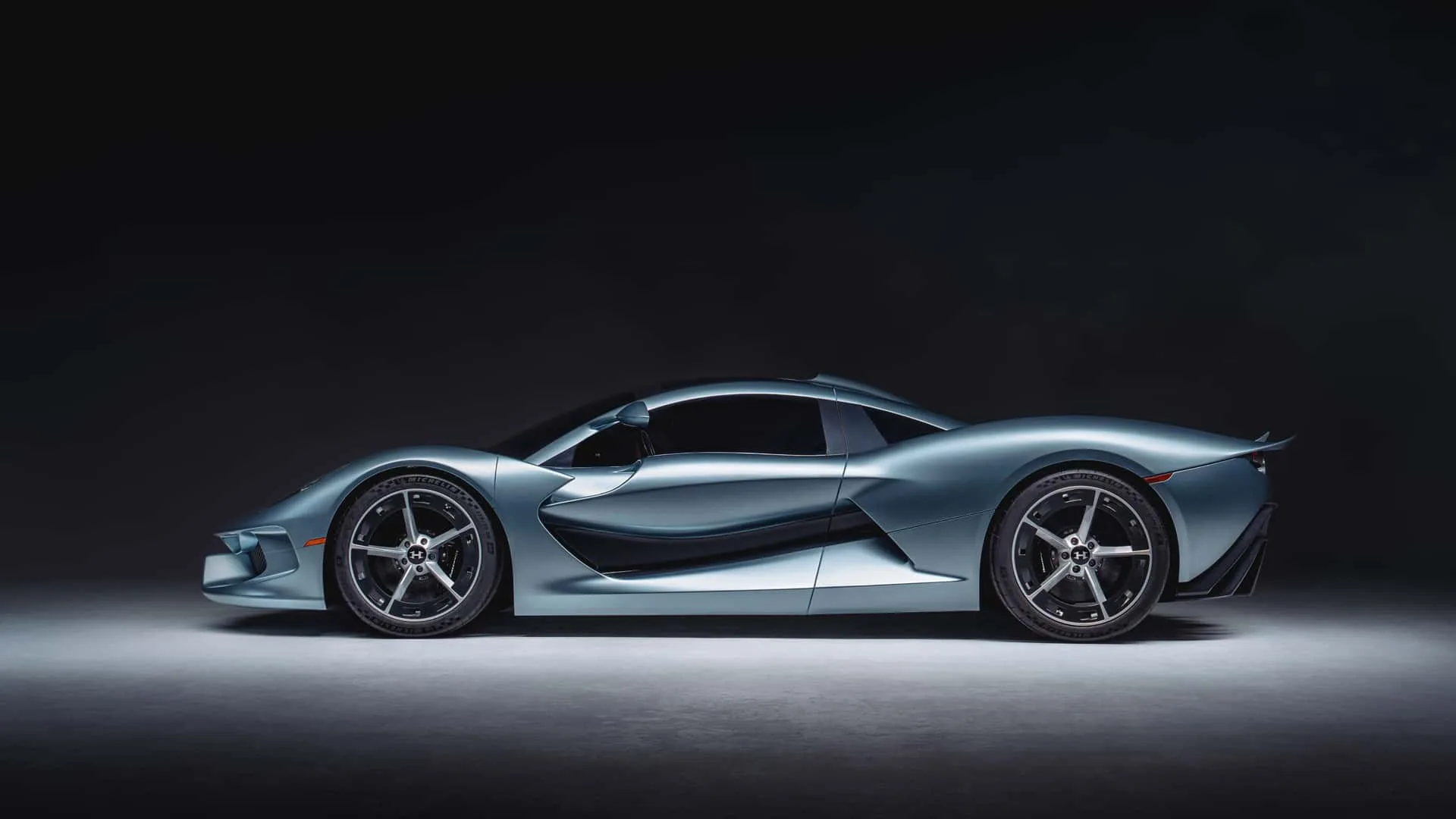 Hennessey Blackbird side profile &mdash; low silhouette, roof scoop, side intakes and 20-inch exclusive wheels wrapped in Michelin Pilot Sport Cup 2 R tires