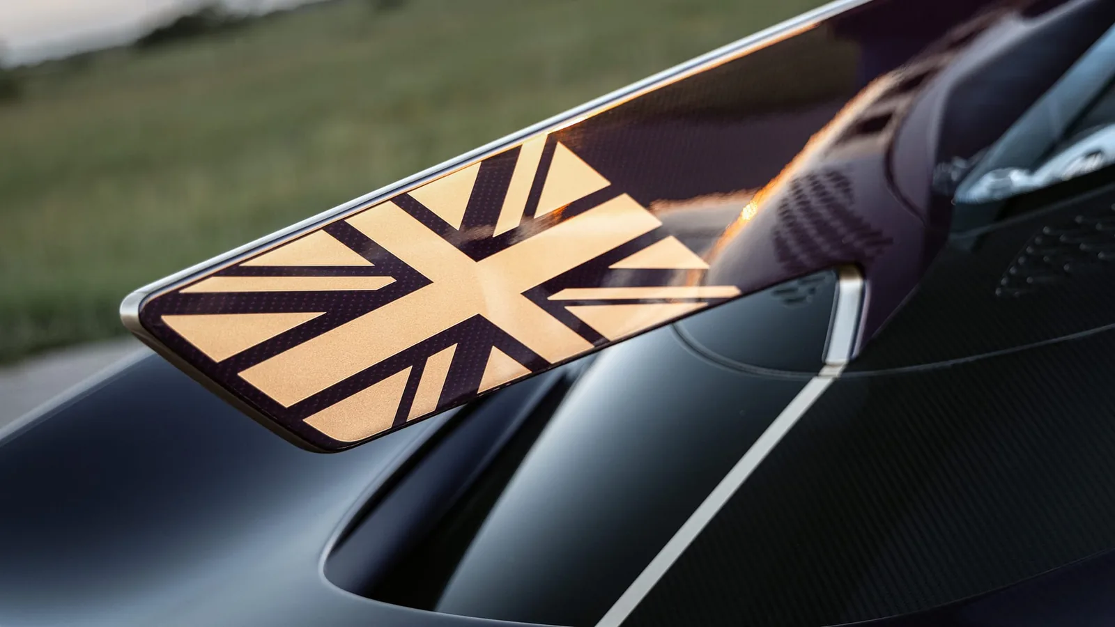 Hennessey Venom F5-M dorsal fin detail — integrated roof scoop feeding the 6.6L Fury V8, with hand-painted Union Jack flag at the trailing edge