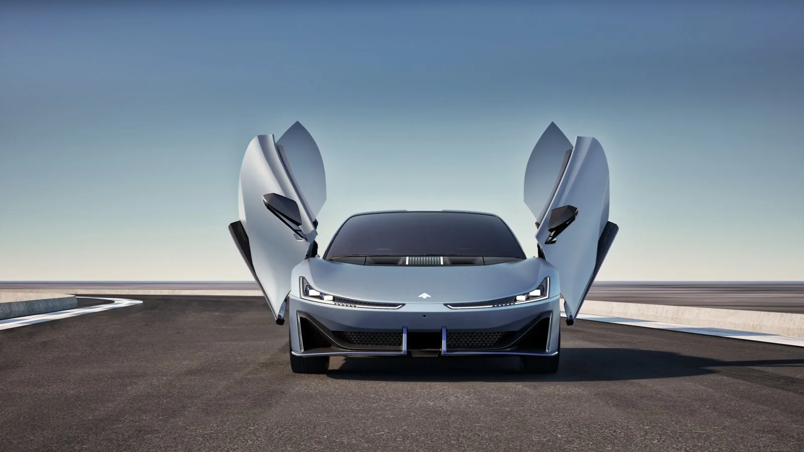 Silver Hyptec SSR electric supercar front view with both butterfly doors open on a race track
