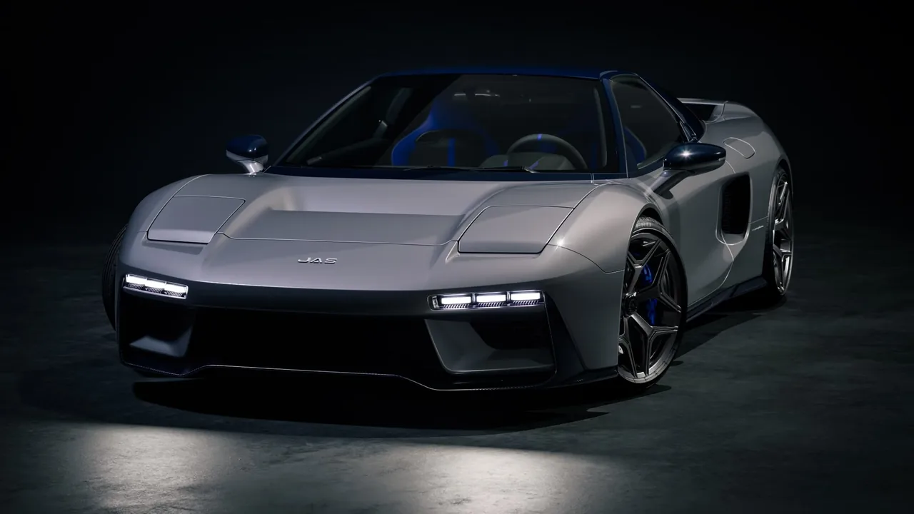 Grey JAS Tensei front three-quarter view with LED lights on and blue brake calipers