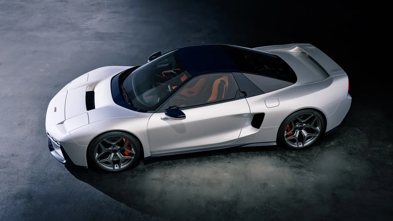White JAS Tensei seen from above and the side, showing the carbon roof, side intake and orange seats