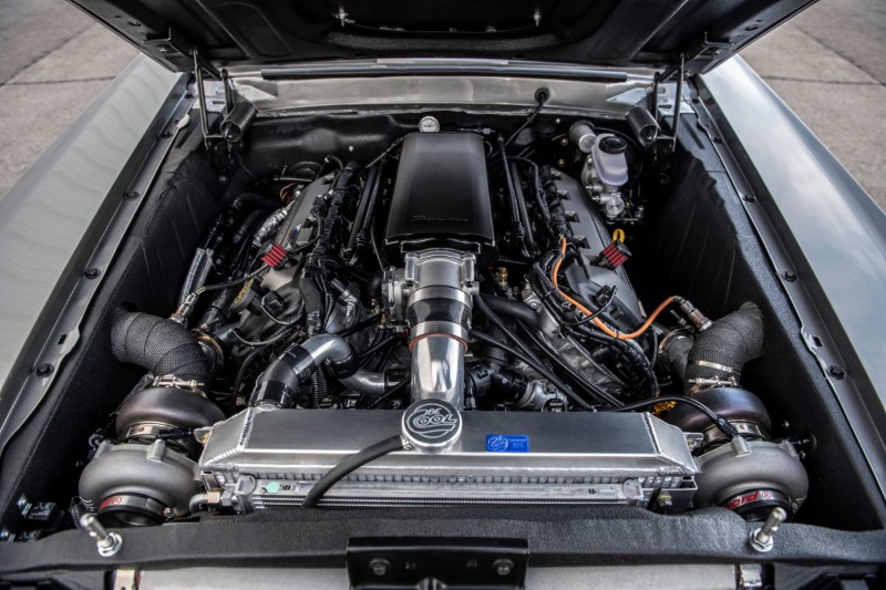 Twin-turbo Coyote V8 engine bay in a modern Classic Recreations Hitman Mustang