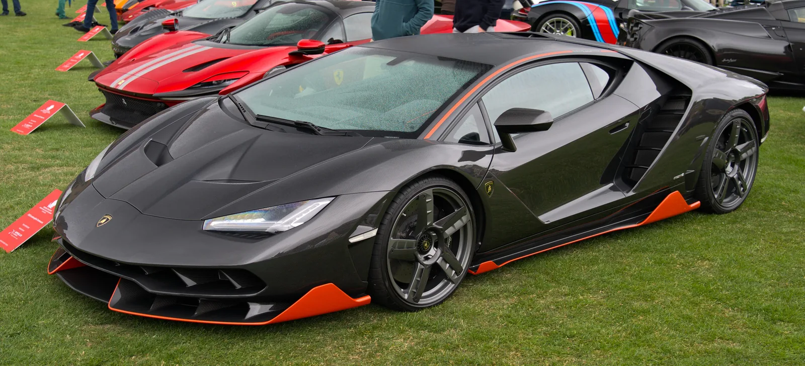 Lamborghini Centenario front three-quarter showing the twin-deck front splitter and Y-shaped LED headlights