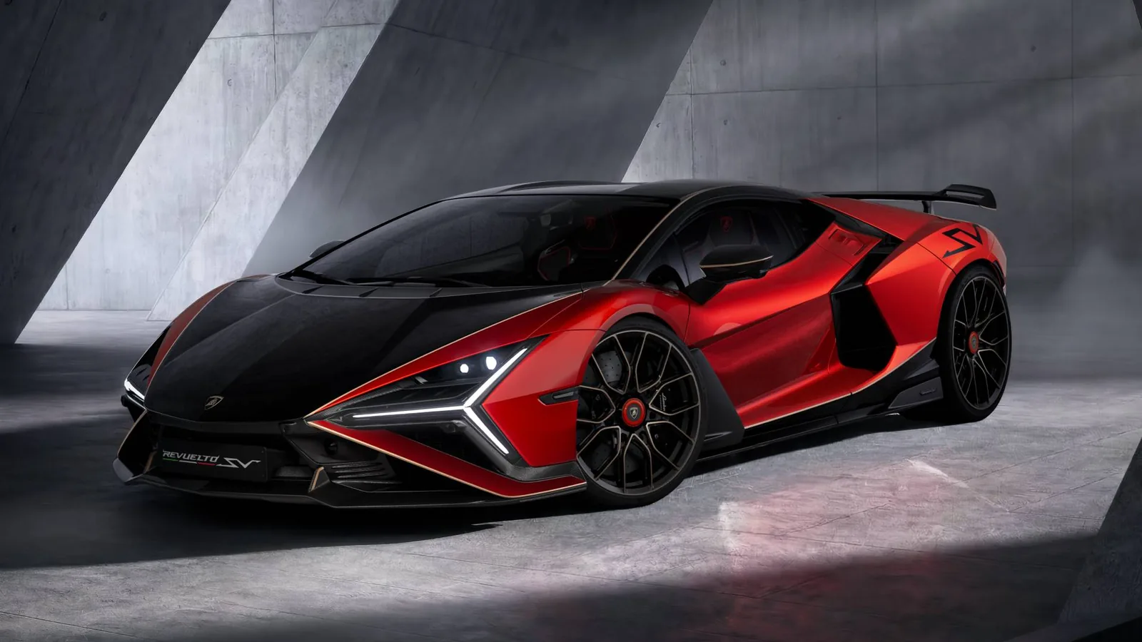 Lamborghini Revuelto SV in red studio lighting, front three-quarter view showing the fixed rear wing, enlarged carbon splitter and quad-exit exhaust of the first hybrid Super Veloce