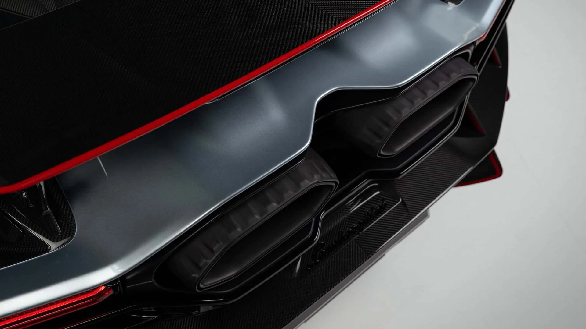 Lamborghini Revuelto SV rear diffuser and central exhaust close-up with carbon fibre bodywork
