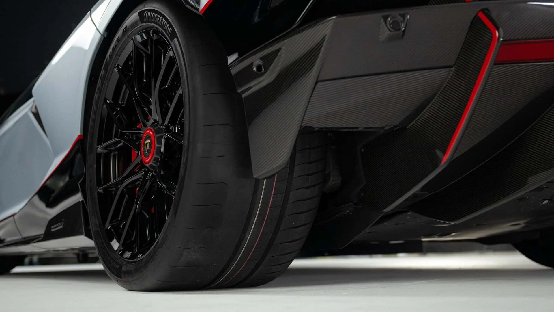 Lamborghini Revuelto SV rear wheel with Bridgestone Potenza Race R tyre and side skirt aerodynamic detail