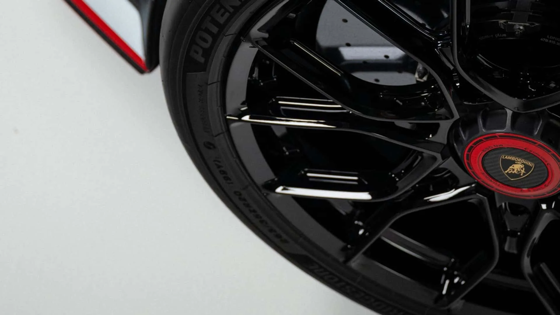 Lamborghini Revuelto SV wheel close-up with Bridgestone Potenza Race R tyre and black multi-spoke design