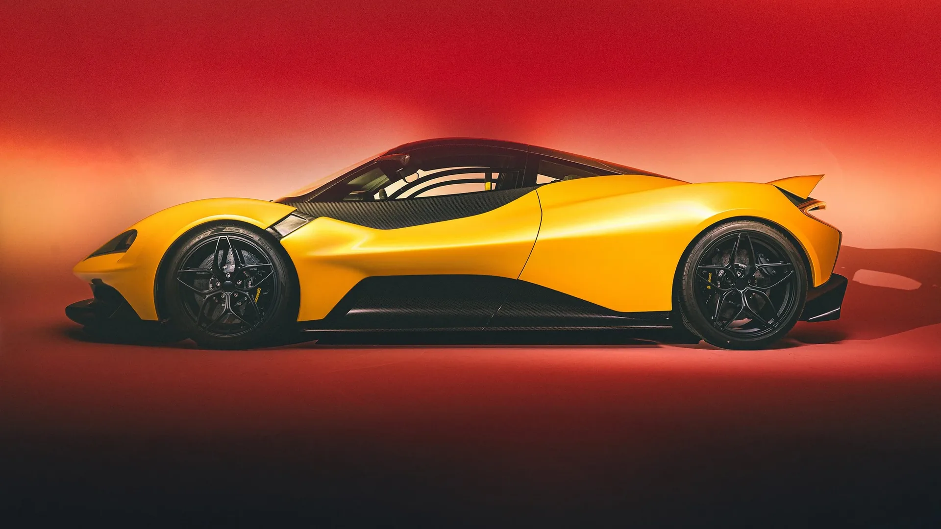 Lanzante 95-59 HDK in yellow, official side-profile rendering with black roof against a red backdrop