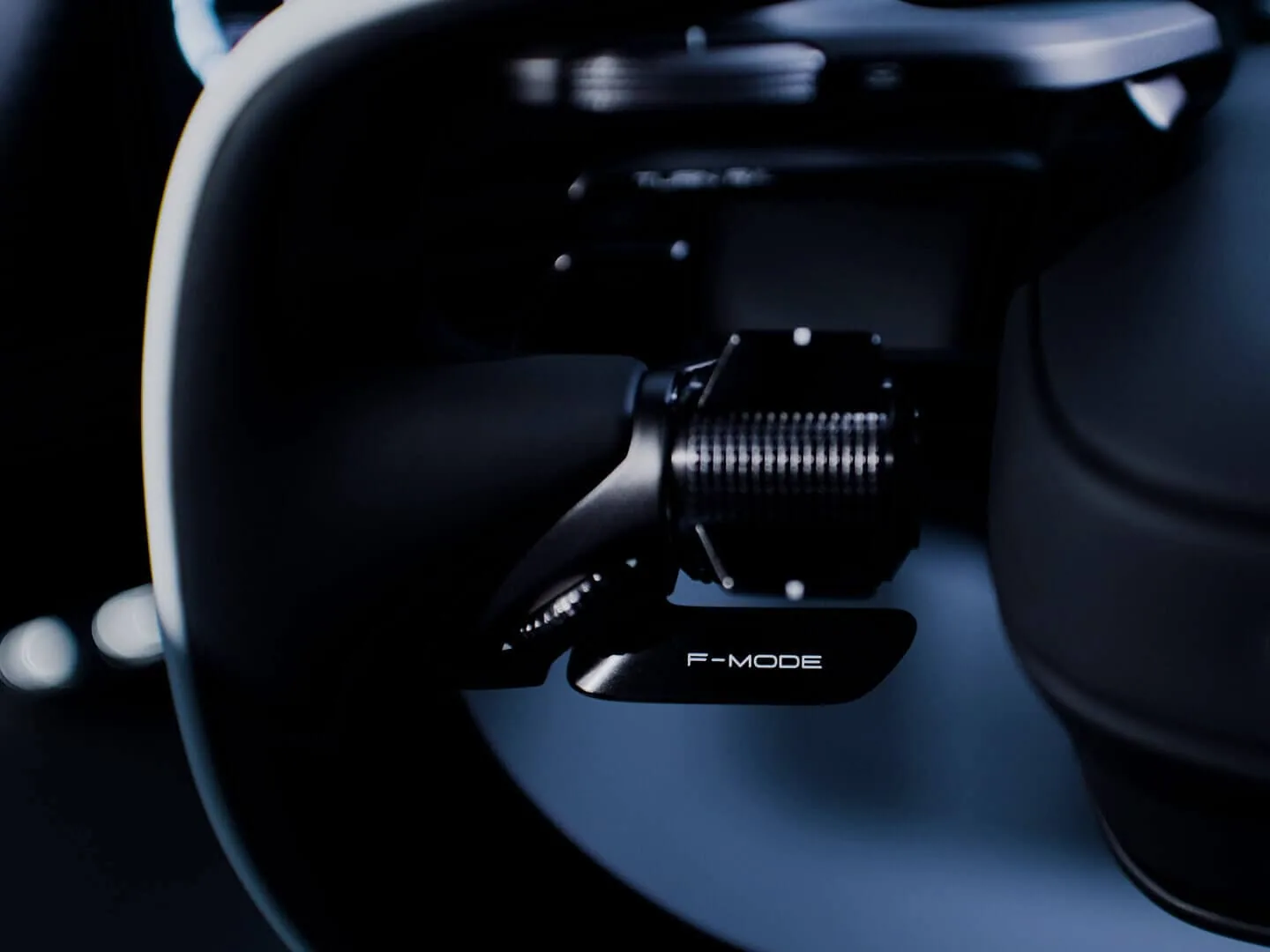 Lexus LFA Concept steering wheel close-up with Boost Mode paddle and integrated haptic controls, no-hand-lift design