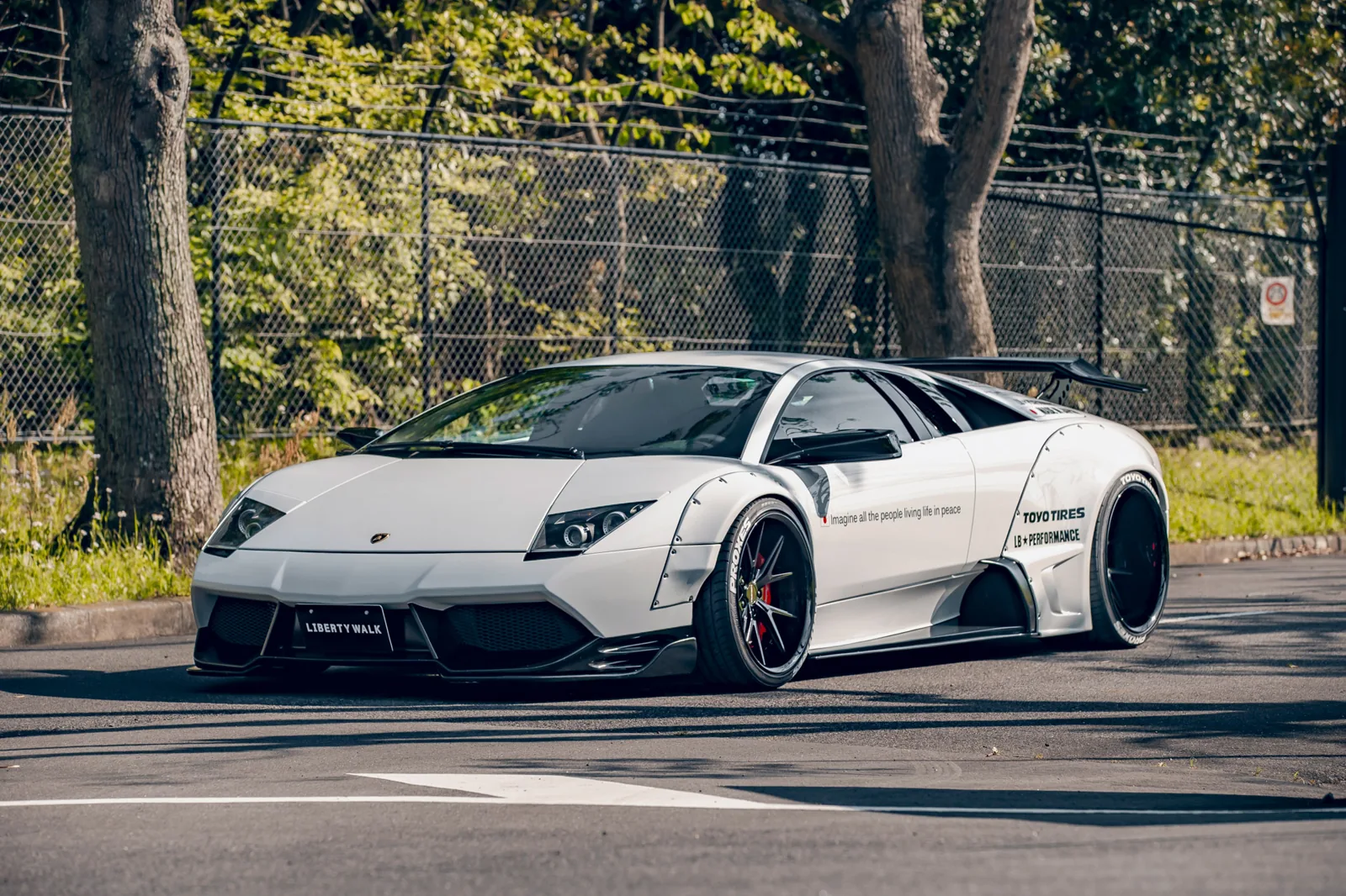 Liberty Walk LB-Works Lamborghini Murcielago in white with riveted wide fender flares, low stance and GT wing — the first LB-Works build from 2012