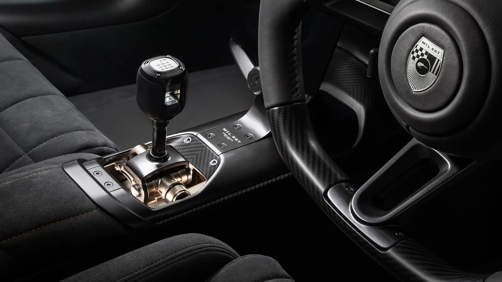 McLaren McL 6GT interior cockpit with digital instrument display, box-quilted seats and manual gearshifter