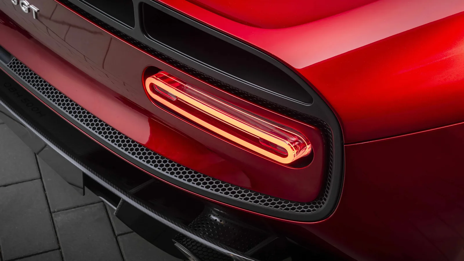 McLaren McL 6GT taillight close-up detail, machined aluminium housings on carbon fibre body