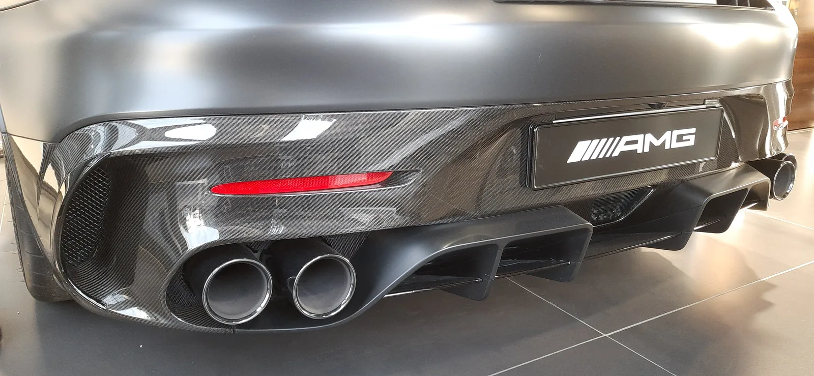 Close-up of the Mercedes-AMG GT Black Series' quad exhaust tips and carbon-fiber rear diffuser