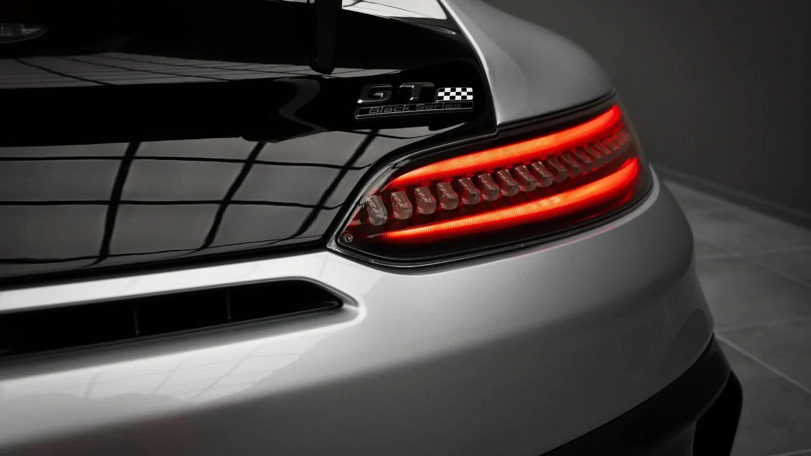 GT Black Series badge and taillight on the silver garage car