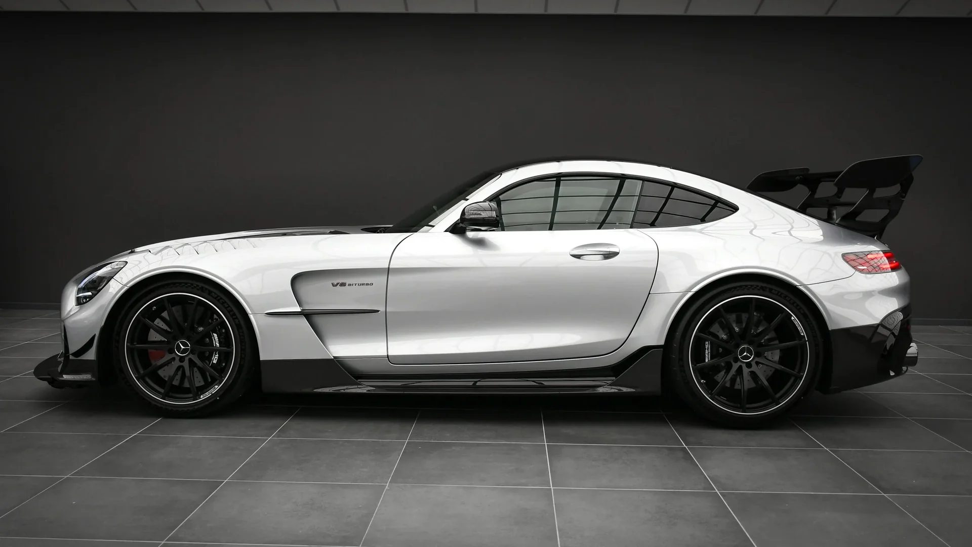 Silver Mercedes-AMG GT Black Series in profile in the Batman Garage studio