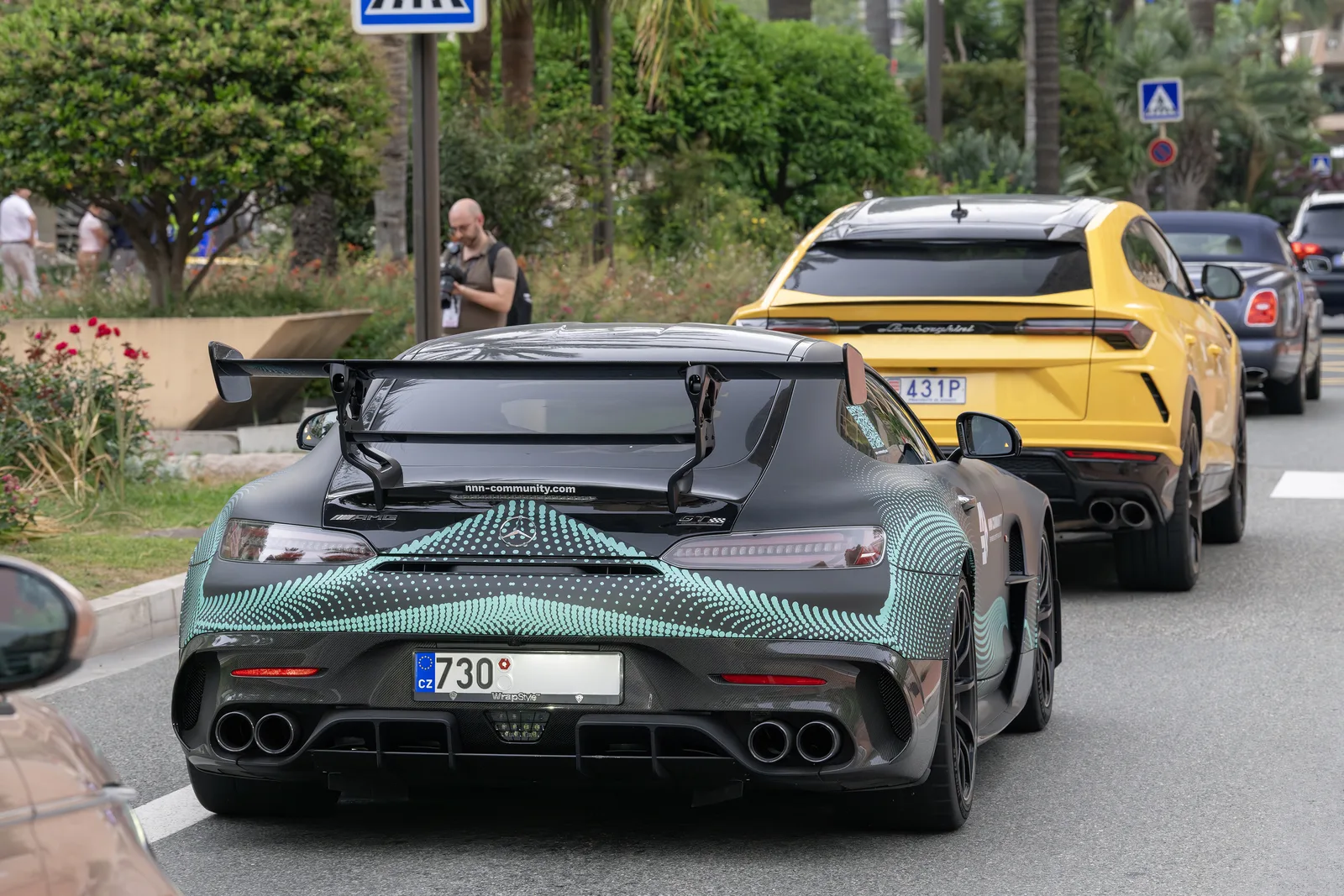 Mercedes-AMG GT Black Series in traffic, rear three-quarter view showing its large fixed rear wing