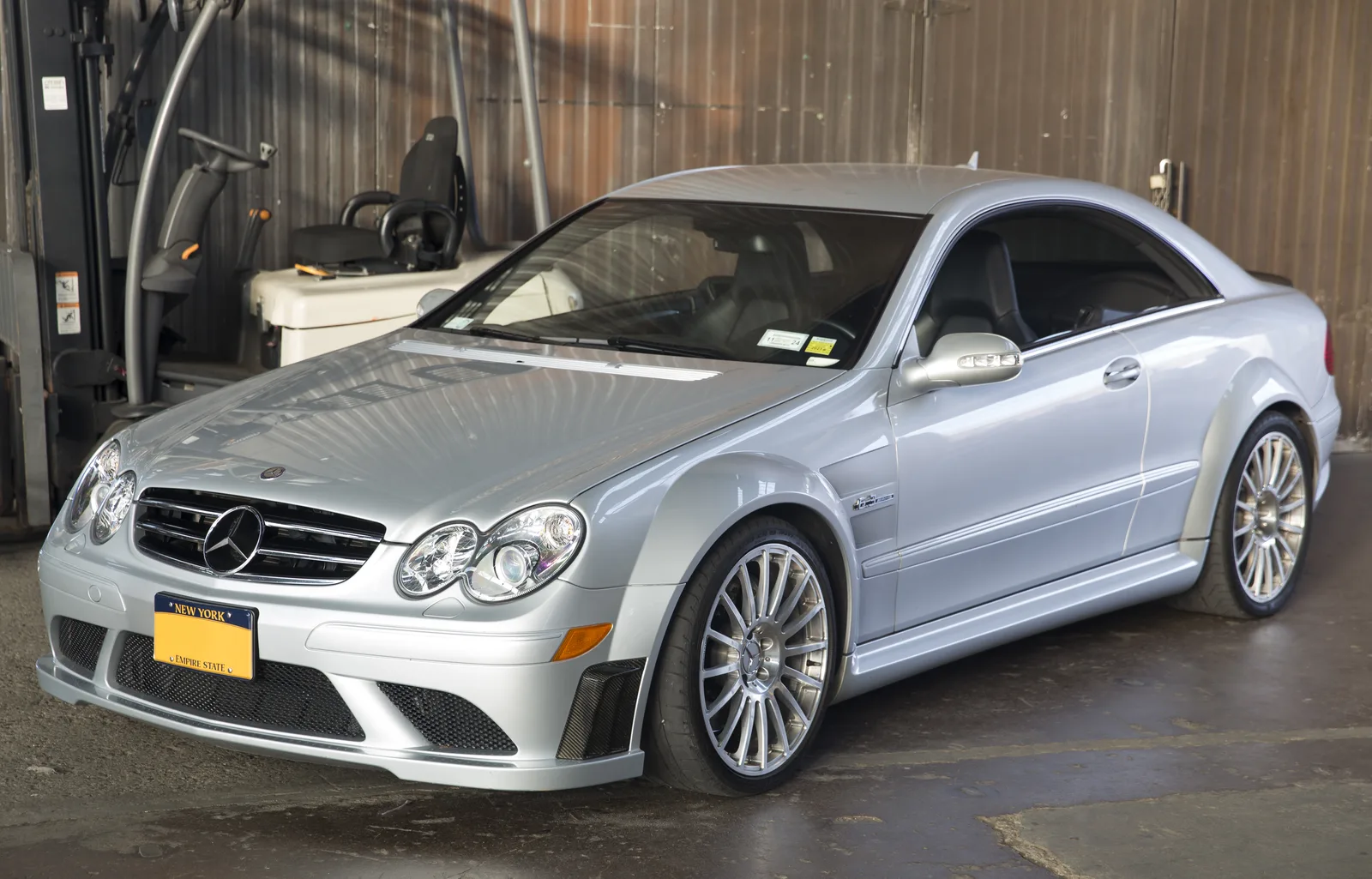 Silver Mercedes-Benz CLK 63 AMG Black Series, front-left three-quarter view, showing its widened front fenders