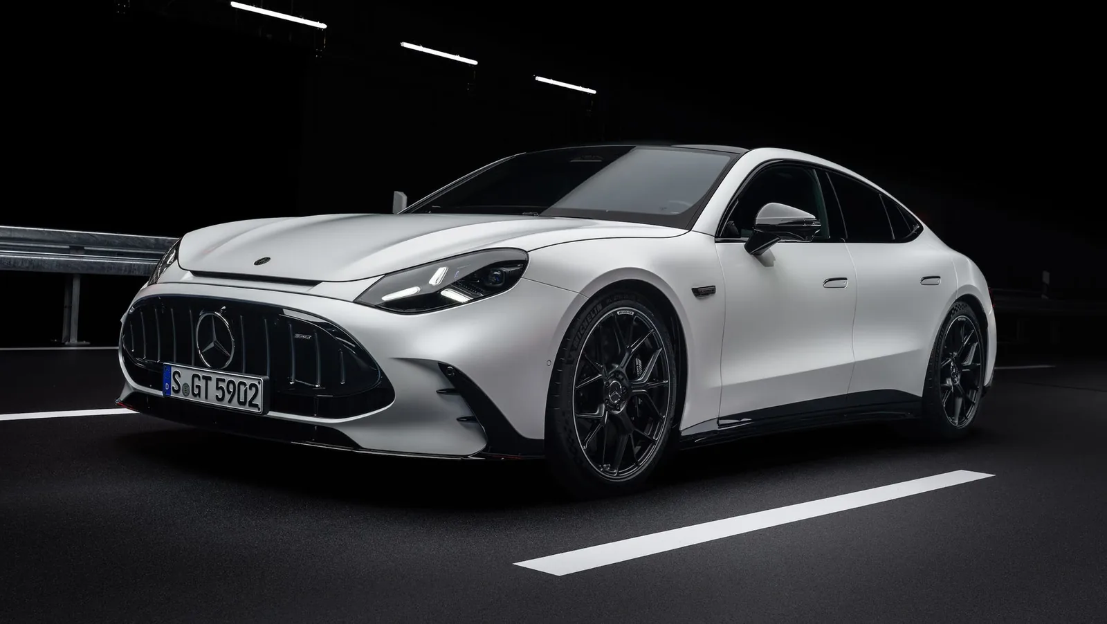 2027 Mercedes-AMG GT 4-Door Coupé EV side profile showing the longer 119.7 inch wheelbase and rakish four-door silhouette that retained much of the outgoing combustion model's proportions despite the EV platform