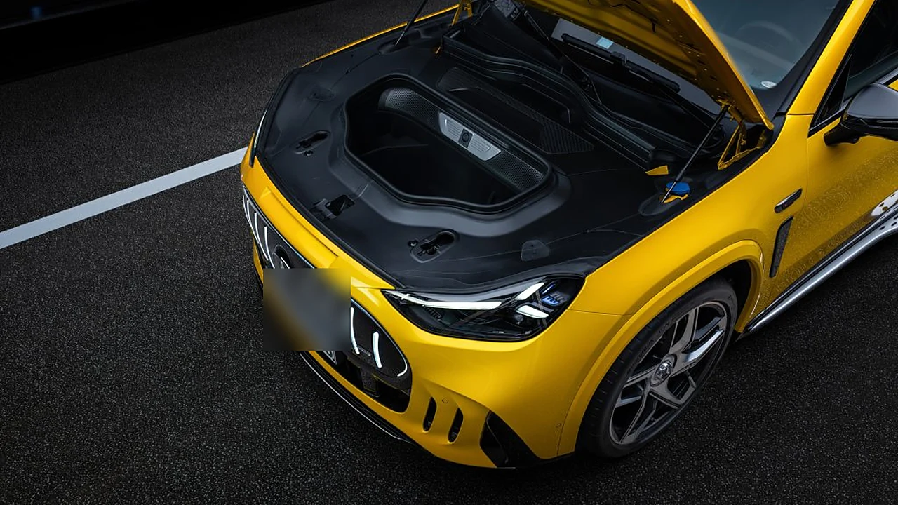 Mercedes-AMG GT SUV front trunk opened, with illuminated vertical grille bars and LED headlight