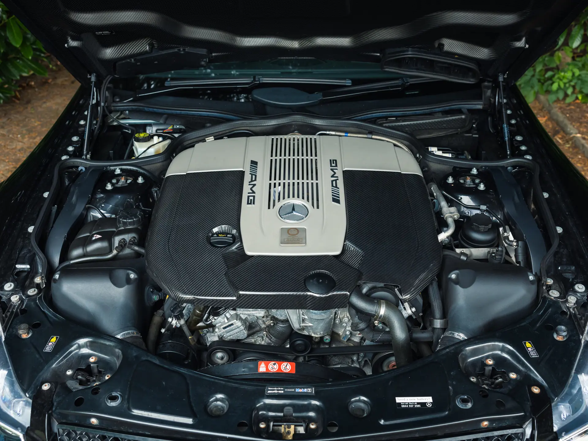 6.0-litre M275 AMG V12 twin-turbo engine bay of the 2009 SL65 AMG Black Series with red AMG cam covers
