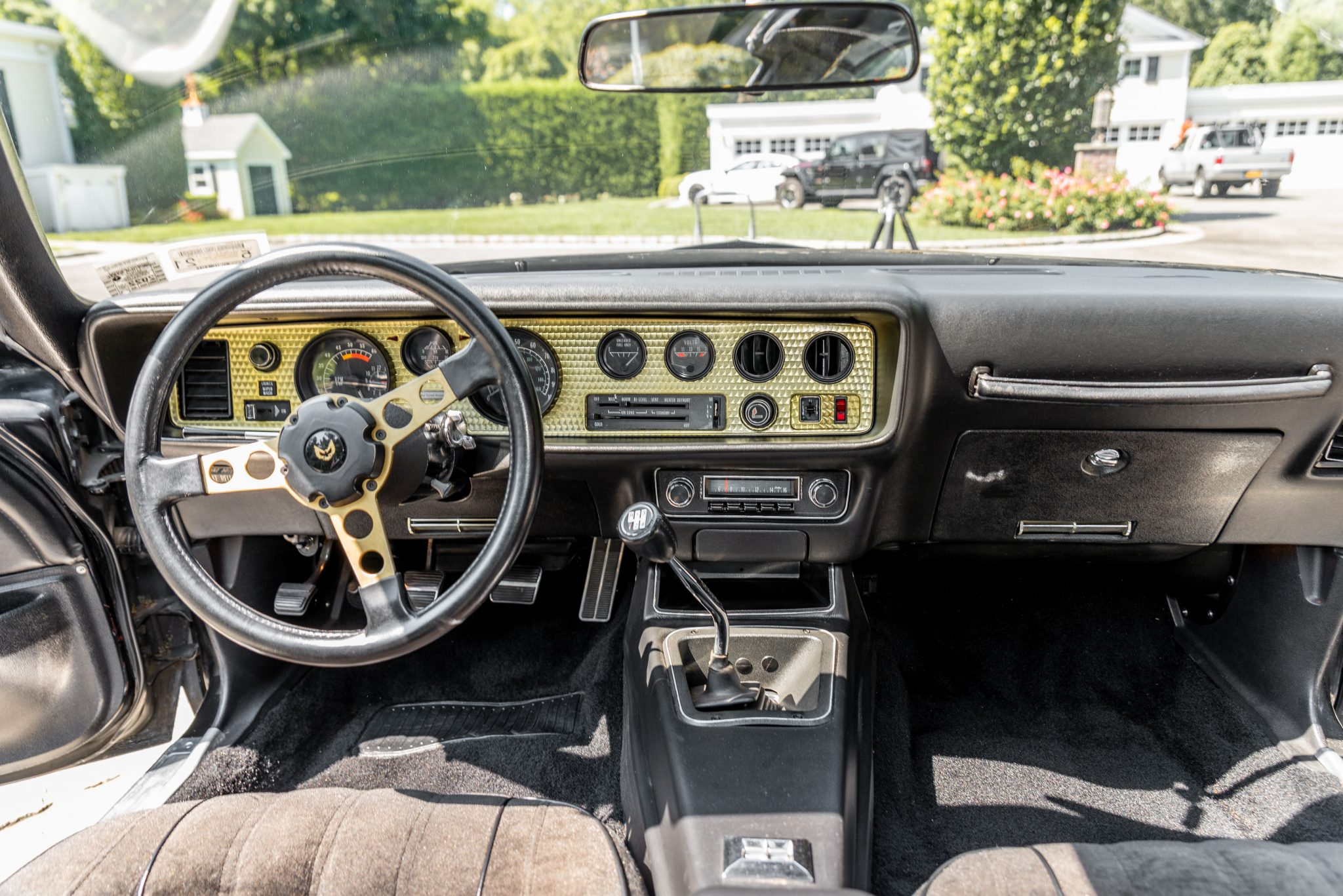 1977 Pontiac Firebird Trans Am dashboard with engine-turned panel and gold steering wheel