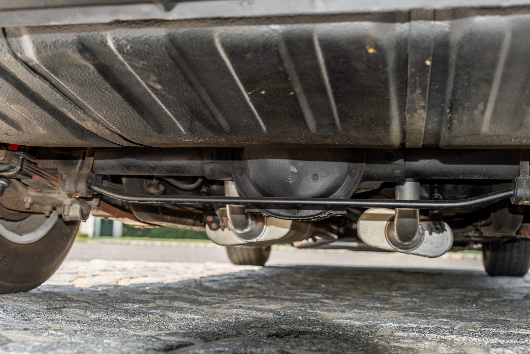 1977 Pontiac Firebird Trans Am rear underbody showing axle and exhaust system