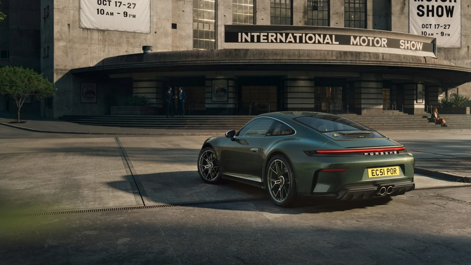 Porsche 911 GT3 Earls Court 51 Edition rear three-quarter showing the wingless Touring body and two-tone green-and-silver wheels