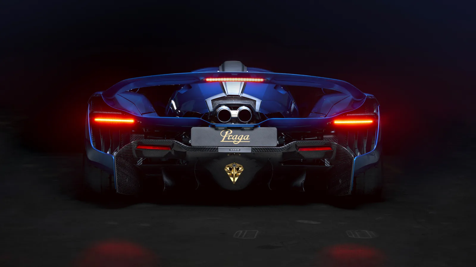 Blue Praga Bohema rear view with red tail lights and central exhaust