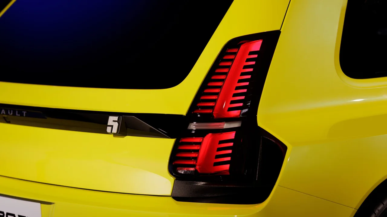 Close-up of the Renault 5 Turbo 3E tail light and 5 badge on yellow bodywork