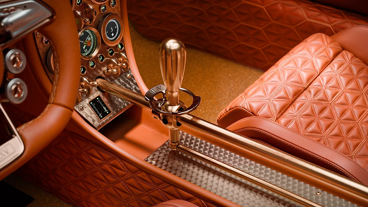 Spyker C8 Preliator XXV exposed manual gear linkage with rose-gold shift lever between quilted brown leather seats