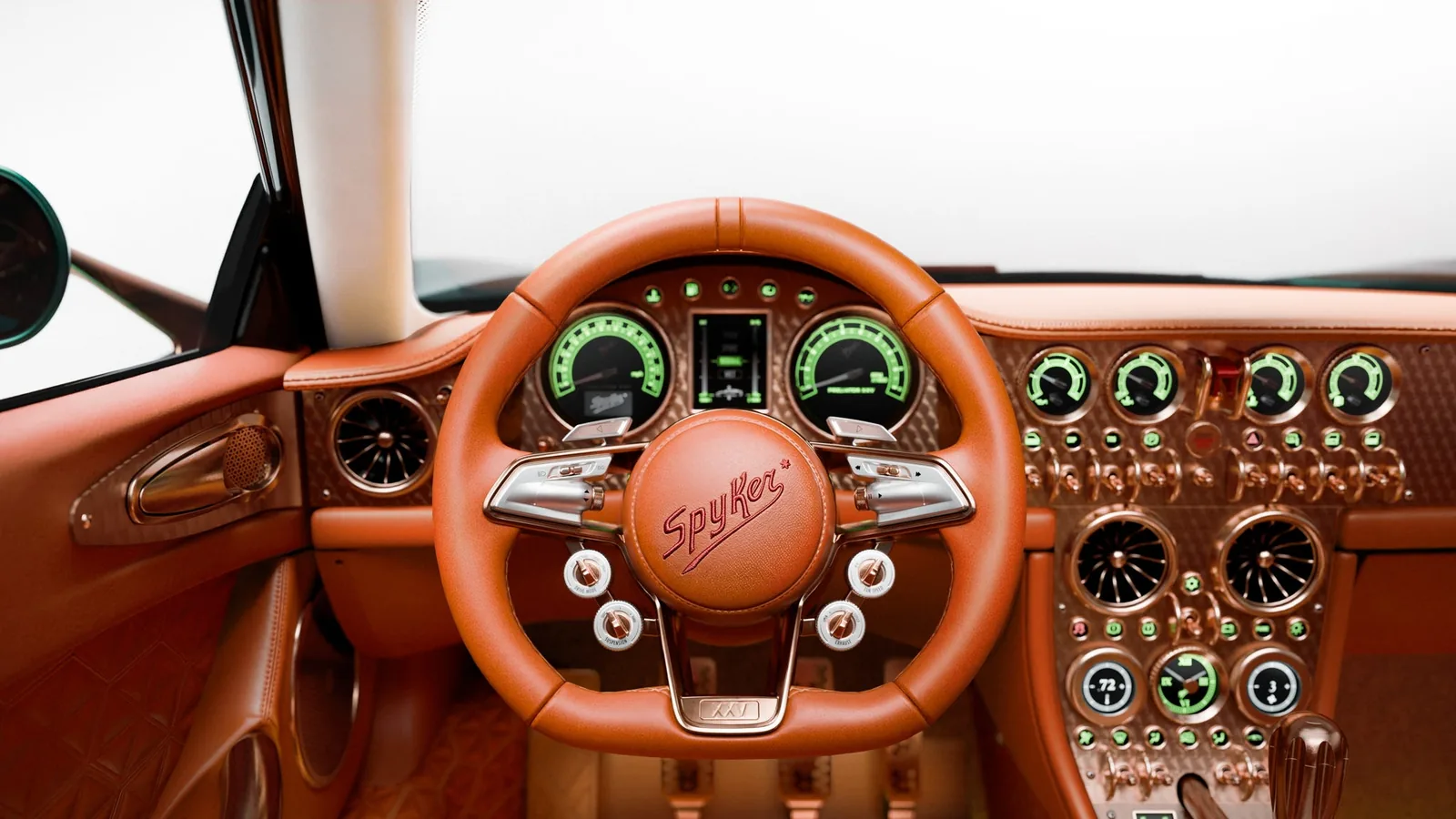 Spyker C8 Preliator XXV steering wheel and green analog gauge cluster with rose-gold switchgear