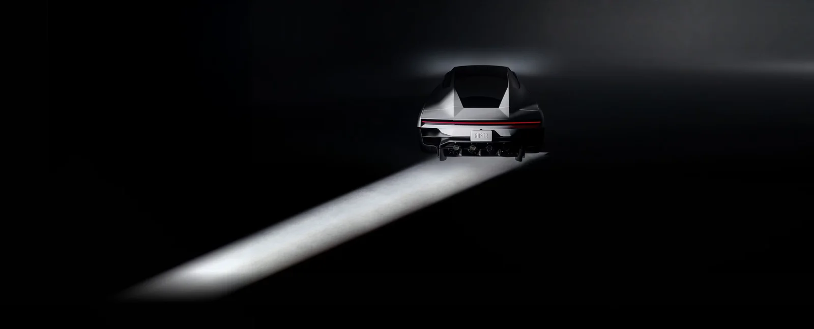 Rear of the Tesla Roadster 2026 with full-width light bar, lit by a beam of light in a dark studio