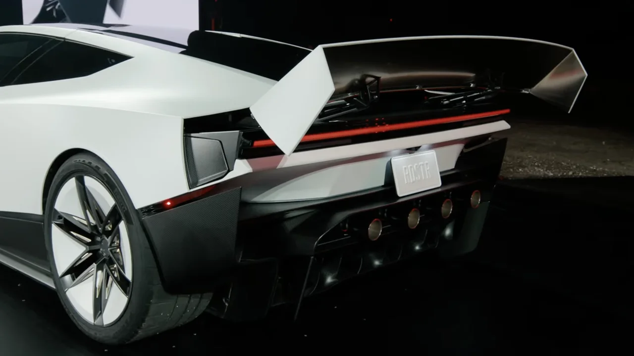 At the reveal: rear thruster nozzles in the carbon diffuser under a huge active wing — the SpaceX package of the Roadster Thrust.
