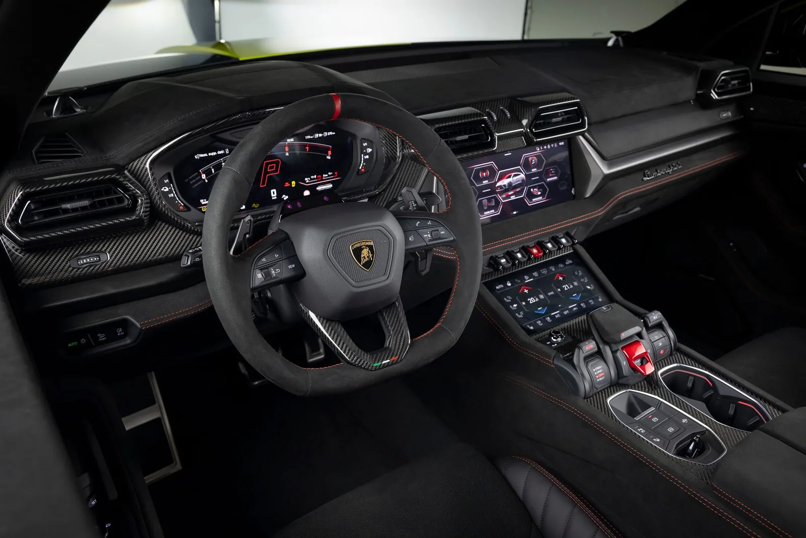 Lamborghini Urus SE Performante interior cockpit — Revuelto-inspired dashboard with 12.3-inch central display and Alcantara sport steering wheel