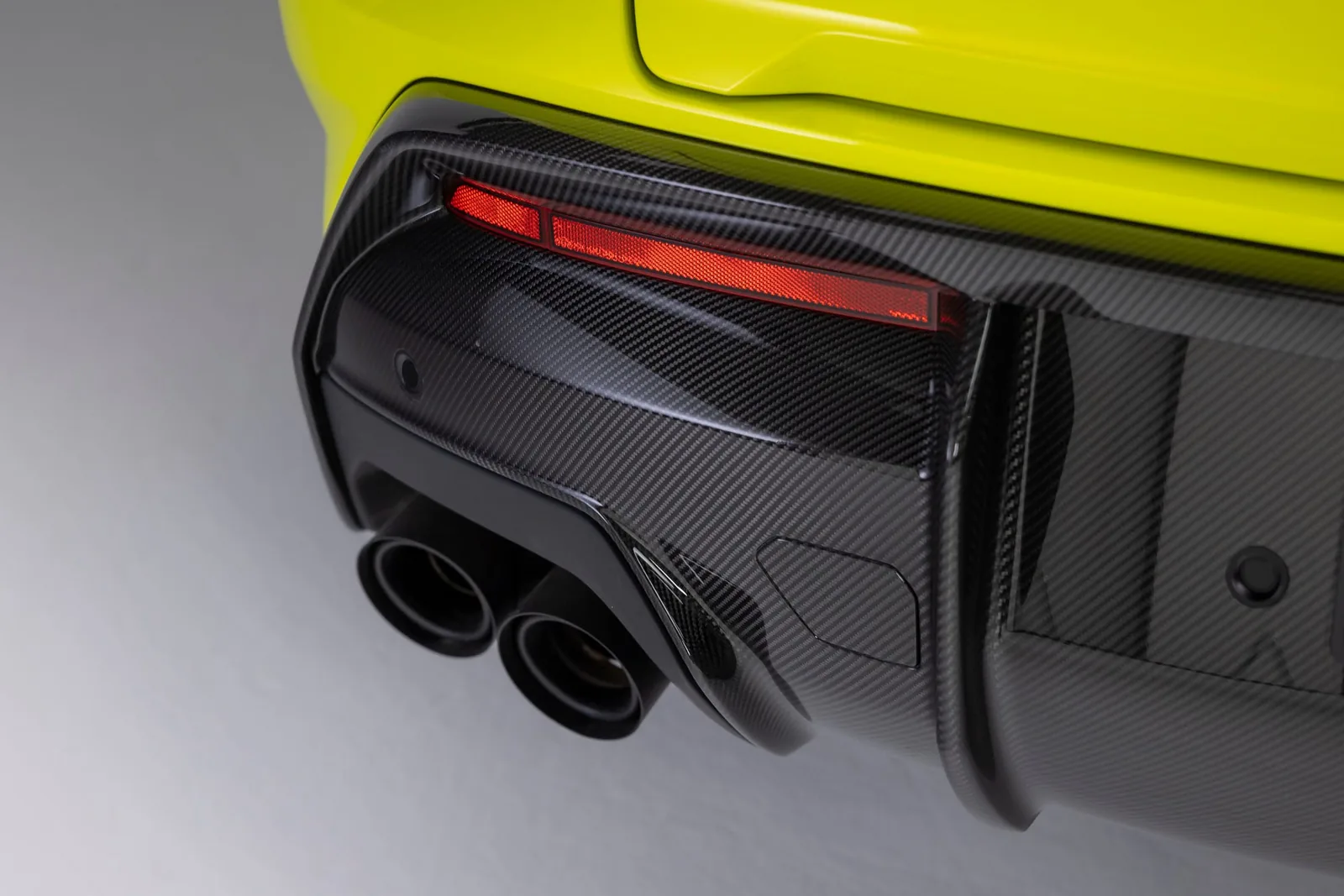 Lamborghini Urus SE Performante rear diffuser and quad Akrapovic titanium exhaust close-up