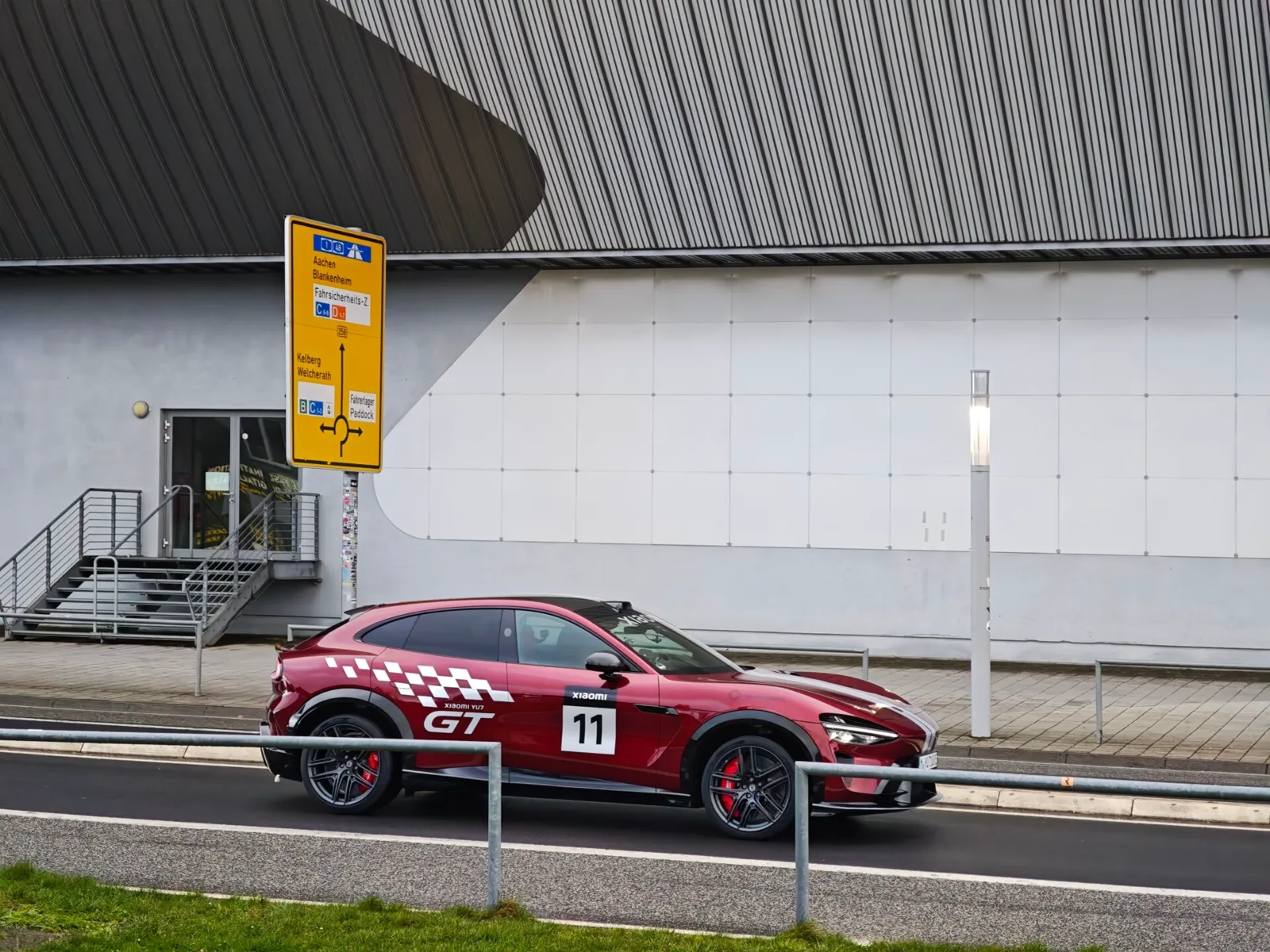 Xiaomi YU7 GT testing at the Nürburgring in racing red livery — proof of European chassis development