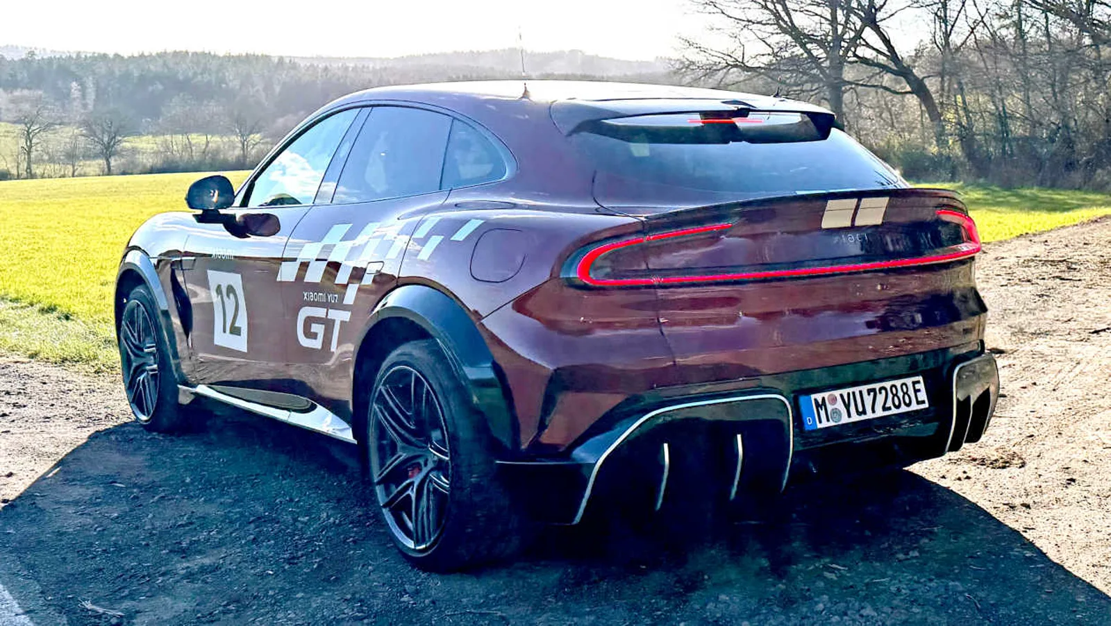 Xiaomi YU7 GT rear three-quarter — full-width LED tail bar and aero diffuser