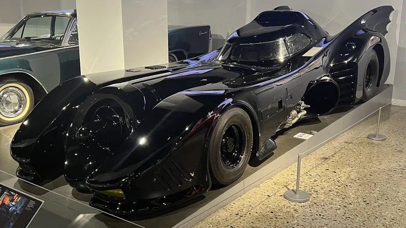 Gloss black Tim Burton Batmobile on display, the same design as the Batman Returns hero car going to auction