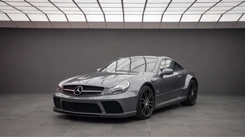 Dark grey Mercedes-Benz SL 65 AMG Black Series in a showroom, front three-quarter view of the only V12 Black Series ever built