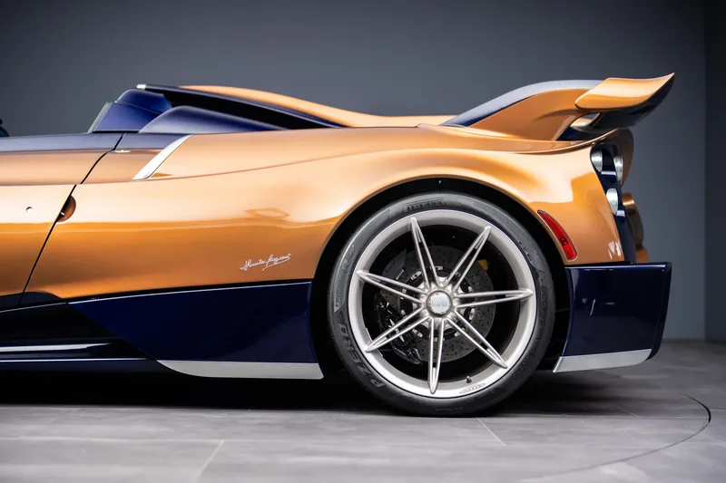 Pagani Huayra 70 Derecho in Pearl Orange over Inky Blue with fish-bone carbon weave, quad centre-exit exhausts and titanium forged wheels at Goodwood Festival of Speed 2026